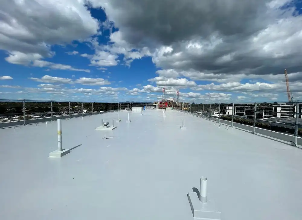 Commercial Waterproofing Services protecting industrial concrete building from long-term water damage